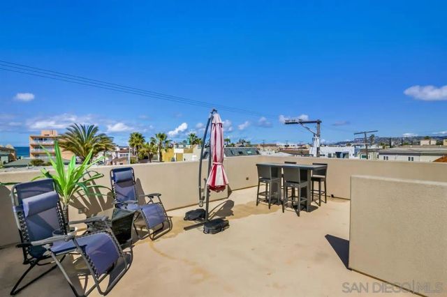 a view of a chairs and table in a patio