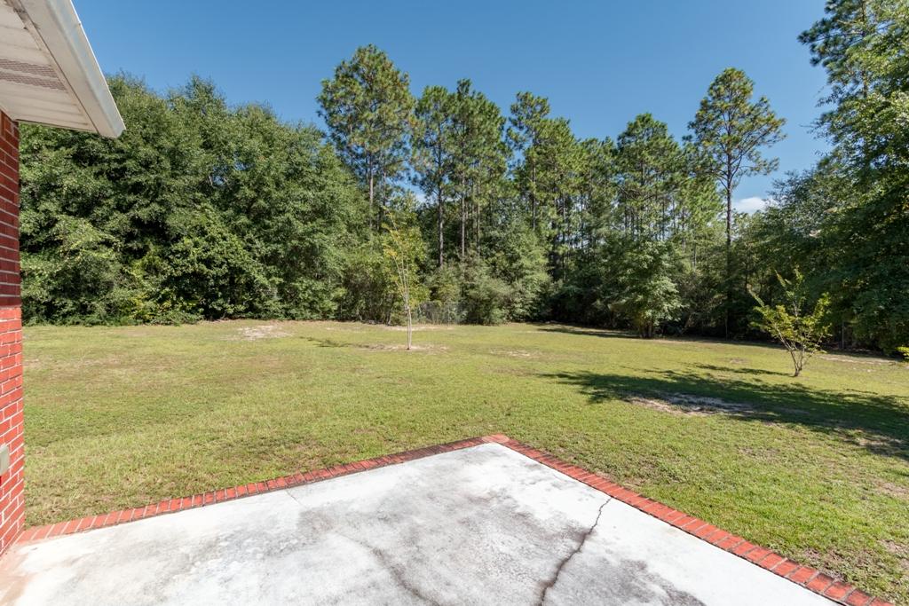 5909 Old Bethel Road Crestview, FL 32536 - Photo 45 of 47 a view of a yard with large trees