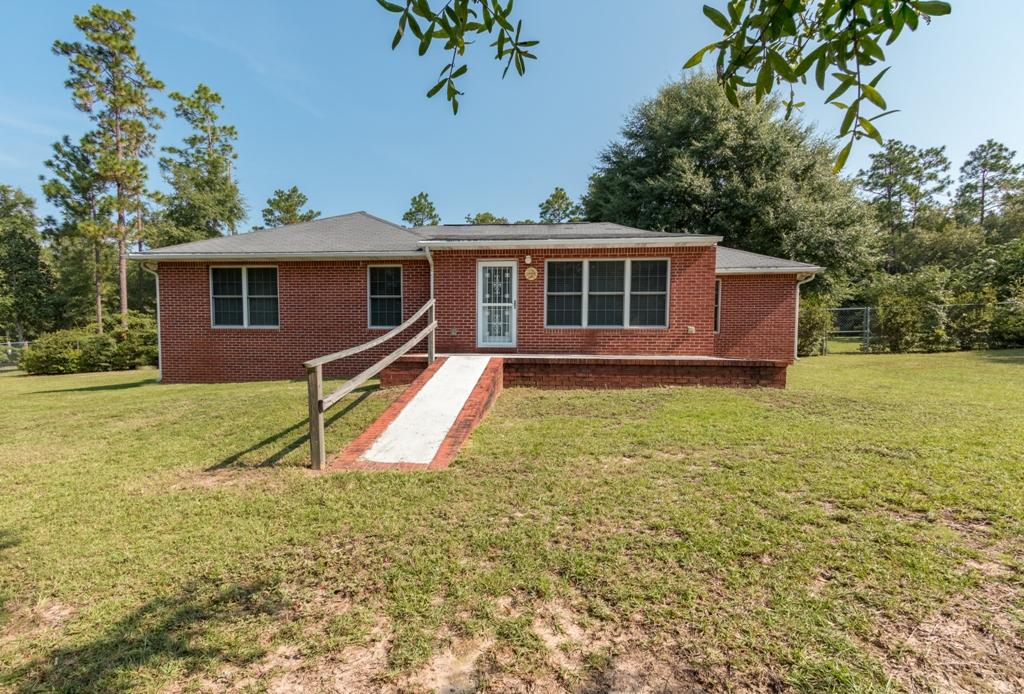 5909 Old Bethel Road Crestview, FL 32536 - Photo 8 of 47 a view of a house with a yard