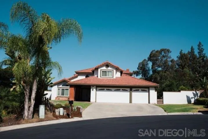 1615 Fuerte Ranch Road El Cajon, CA 92019 - Photo 1 of 17 a front view of a house with a yard