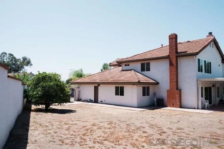 1615 Fuerte Ranch Road El Cajon, CA 92019 - Photo 12 of 17 a front view of a house with a yard and garage