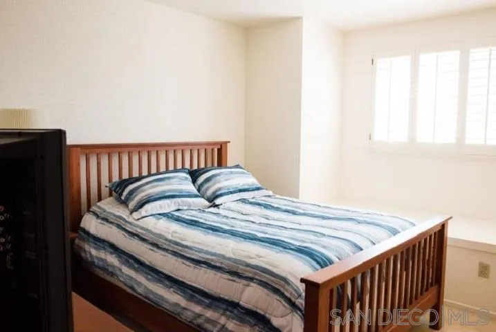 1615 Fuerte Ranch Road El Cajon, CA 92019 - Photo 6 of 17 a bed sitting in a bedroom next to a window