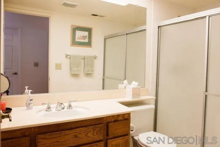 1615 Fuerte Ranch Road El Cajon, CA 92019 - Photo 8 of 17 a bathroom with a sink and a mirror