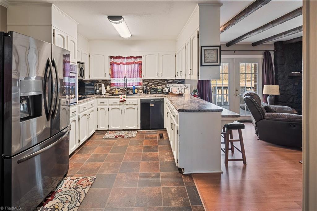 2198 South McKinney Road Mount Airy, NC 27030 - Photo 10 of 48 Kitchen, living room and french doors to the deck.