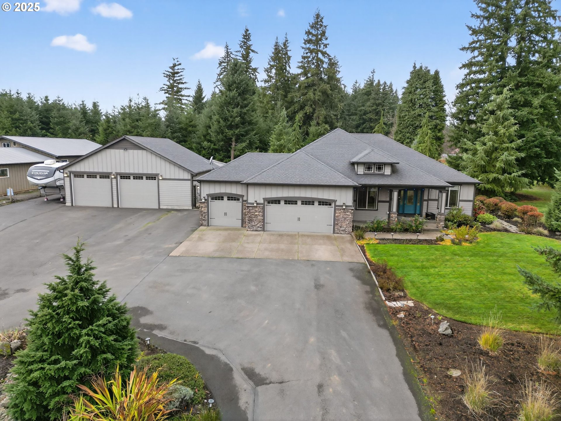 18740 South Upper Highland Road Beavercreek, OR 97004 - Photo 2 of 48 a aerial view of a house with a yard and large trees