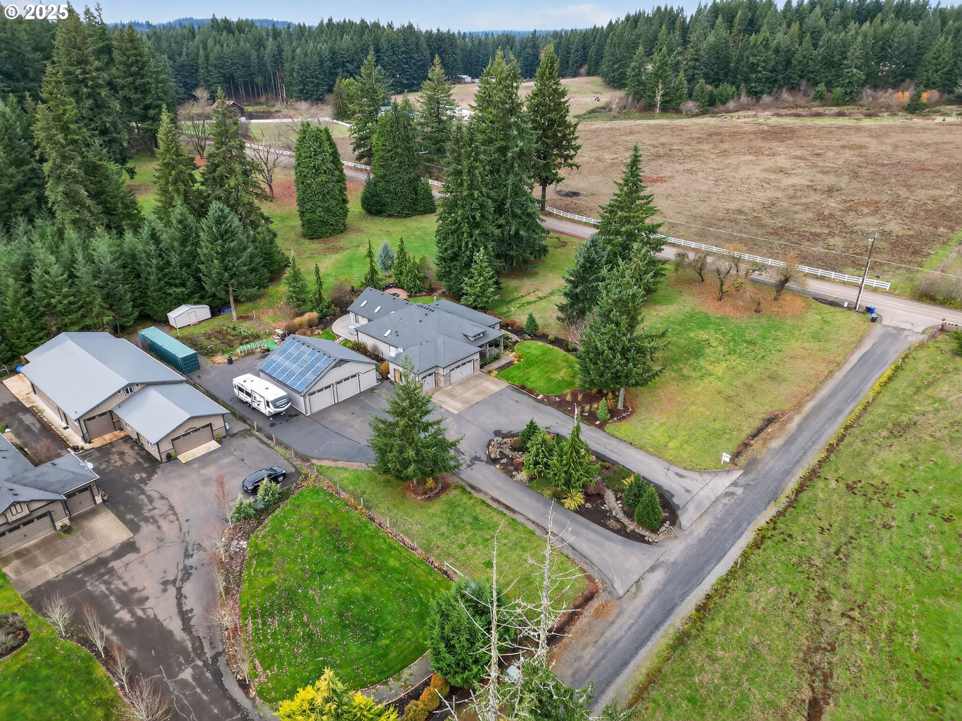 18740 South Upper Highland Road Beavercreek, OR 97004 - Photo 47 of 48 aerial view of a house with a yard and lake view