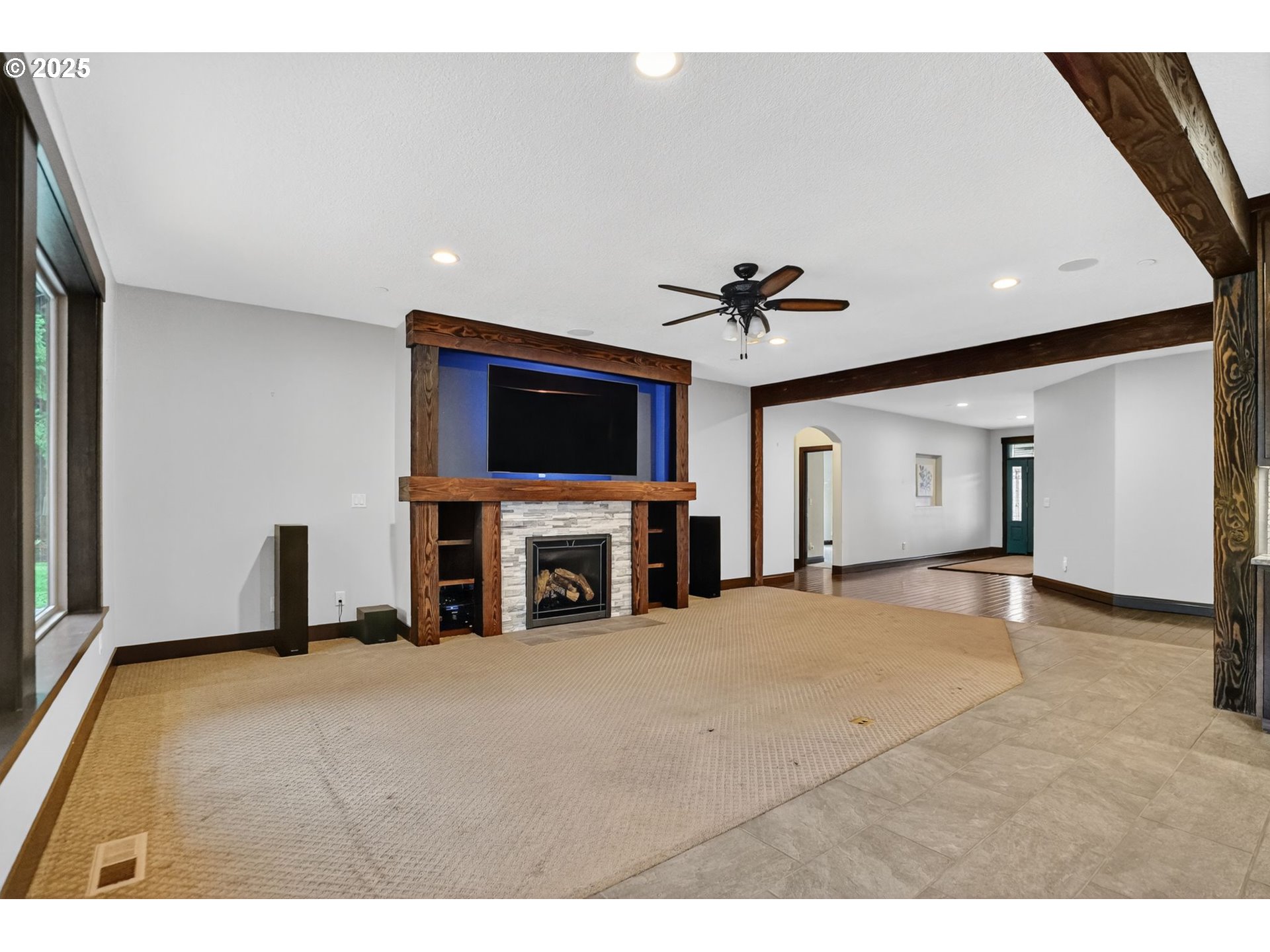 18740 South Upper Highland Road Beavercreek, OR 97004 - Photo 9 of 48 a living room with fireplace and flat screen tv