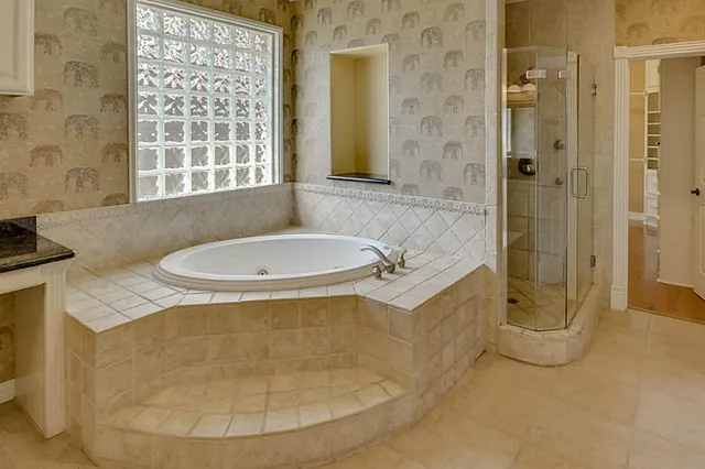 a view of wooden floor and windows in a room