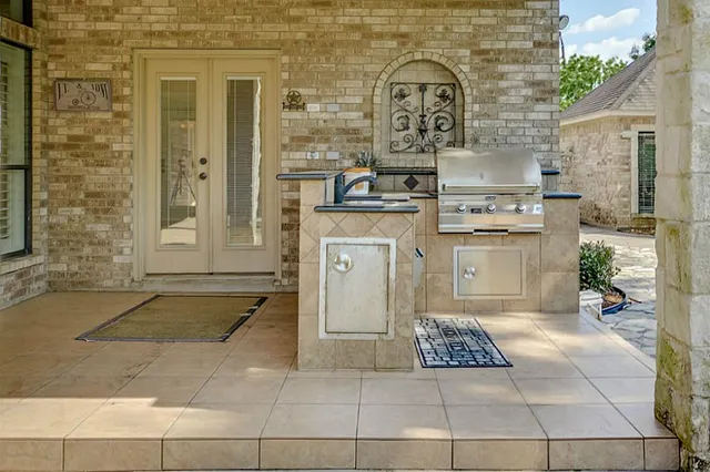 a view of a house with swimming pool and sitting area