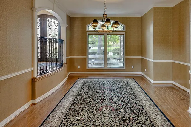 a view of an entryway with wooden floor