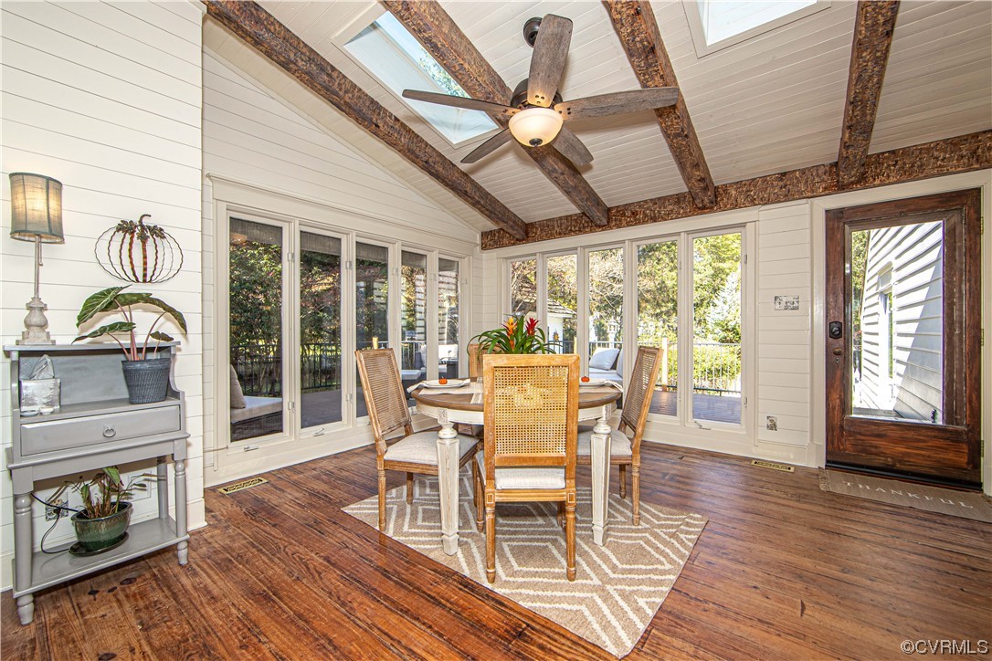 14420 West Salisbury Road Midlothian, VA 23113 - Photo 21 of 50 a dining room with wooden floor a chandelier a glass table and chairs
