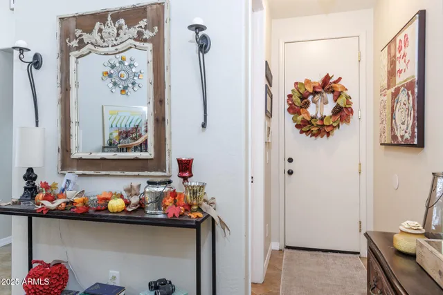 a dining table with chairs and chandelier
