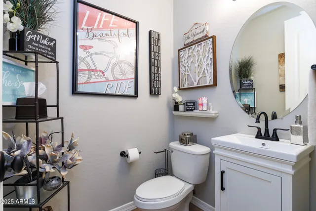 a living room with fireplace furniture and a chandelier