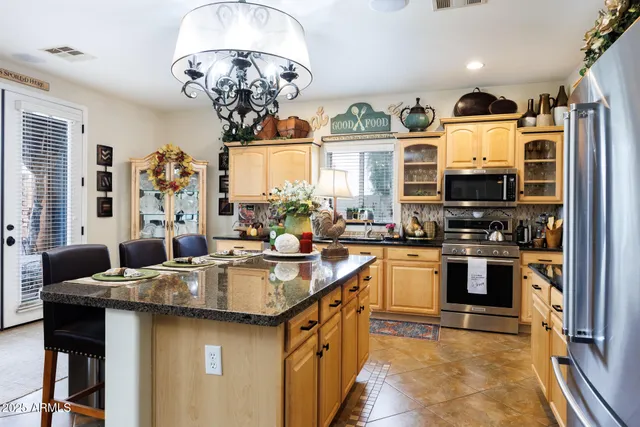a bathroom with a double vanity sink a mirror and shower