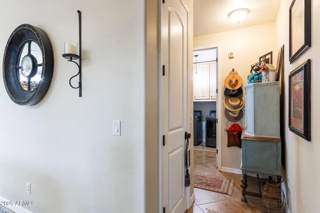 a living room with furniture a ceiling fan and a window