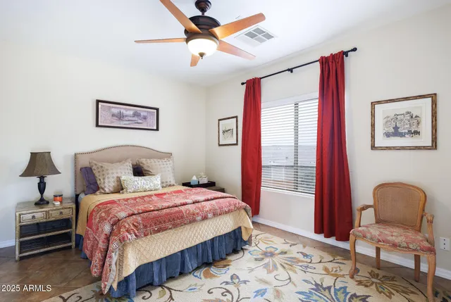a view of a building with potted plants and floor to ceiling window