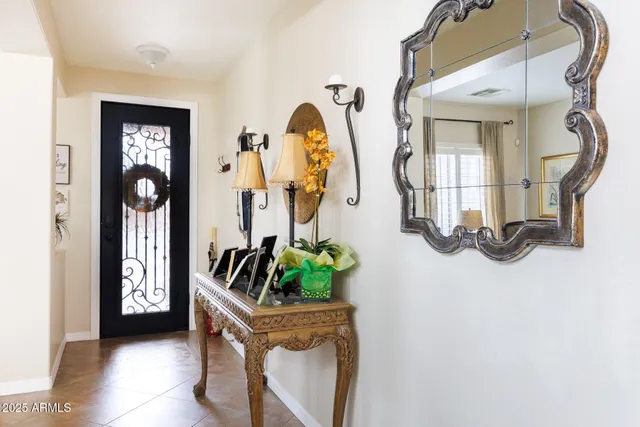 a view of a dining room with furniture wooden floor and chandelier
