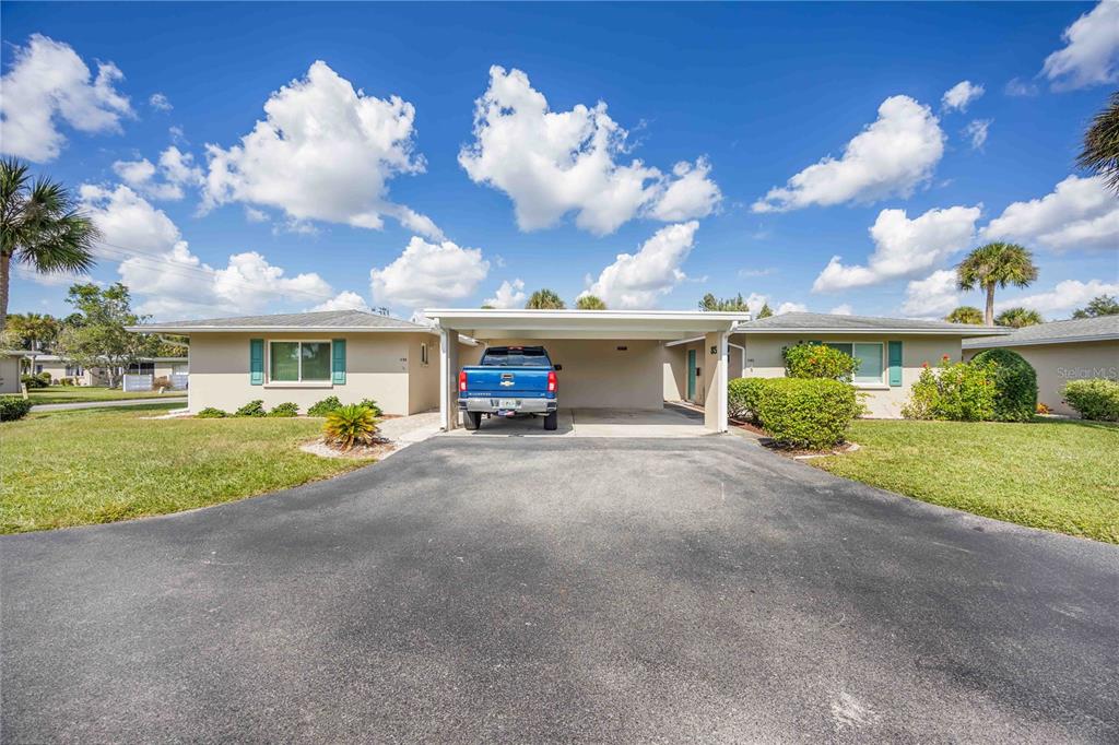 85 Strathmore Boulevard Sarasota, FL 34233 - Photo 1 of 1 a view of a house next to a yard