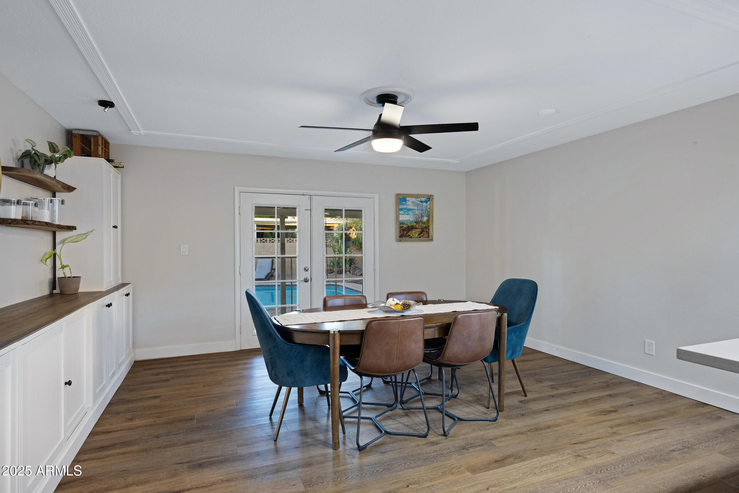 1824 West Seldon Lane Phoenix, AZ 85021 - Photo 12 of 34 a view of a dining room with furniture window and wooden floor
