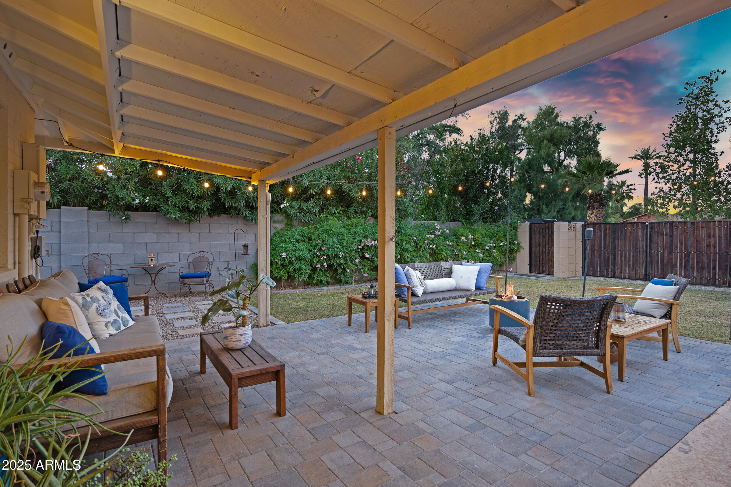 1824 West Seldon Lane Phoenix, AZ 85021 - Photo 22 of 34 a view of a patio with table and chairs potted plants with wooden floor and fence