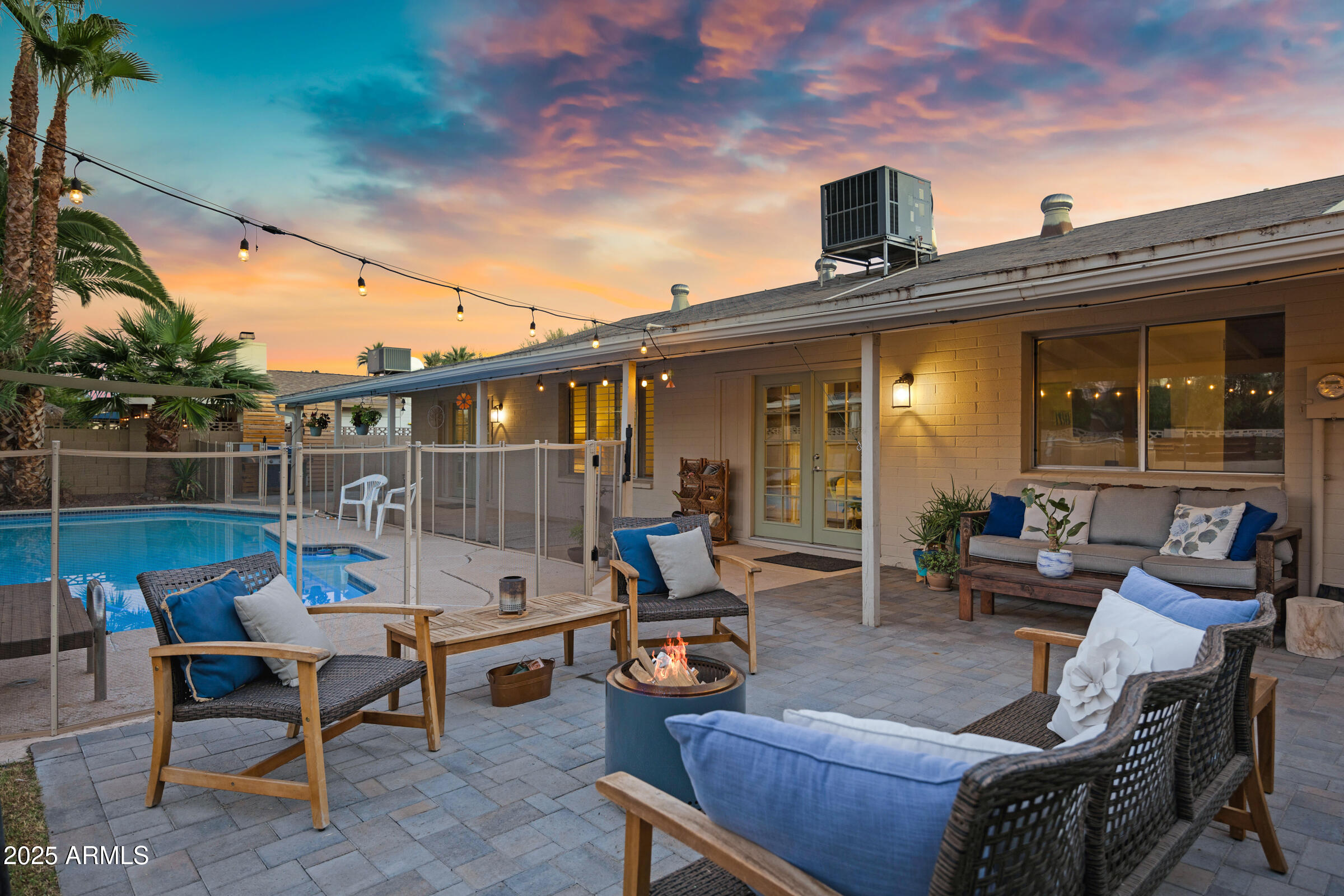 1824 West Seldon Lane Phoenix, AZ 85021 - Photo 23 of 34 a view of a patio with couches chairs and table and chairs with wooden floor