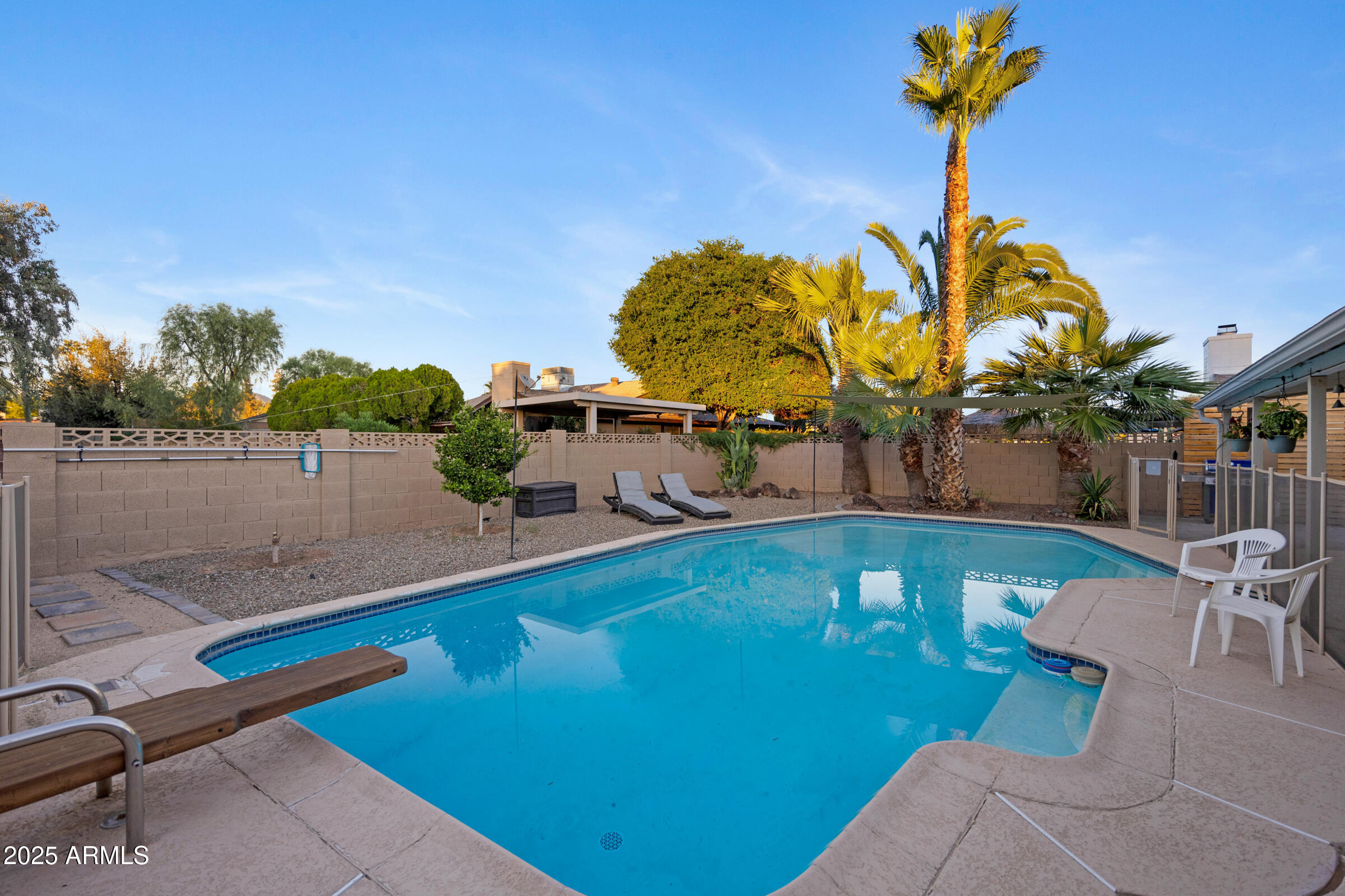 1824 West Seldon Lane Phoenix, AZ 85021 - Photo 28 of 34 a view of a swimming pool with a table and chairs