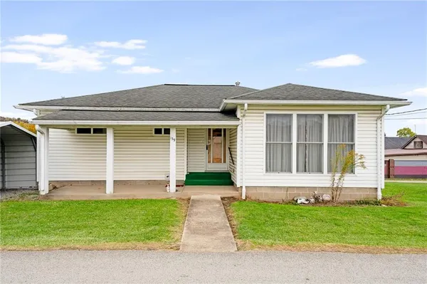 front view of a house with a yard