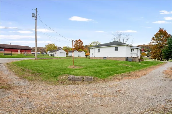 a view of a house with a yard and plants
