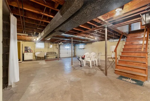 a view of empty room with wooden ceiling