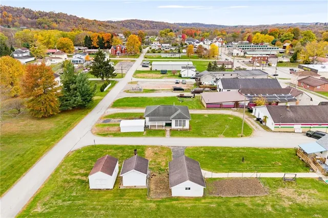 an aerial view of residential houses with outdoor space