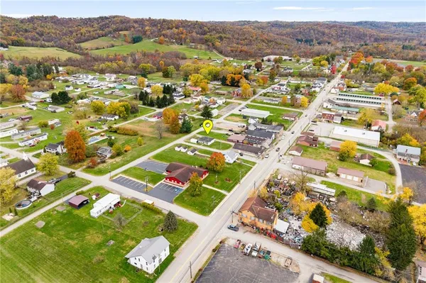 an aerial view of residential houses with outdoor space