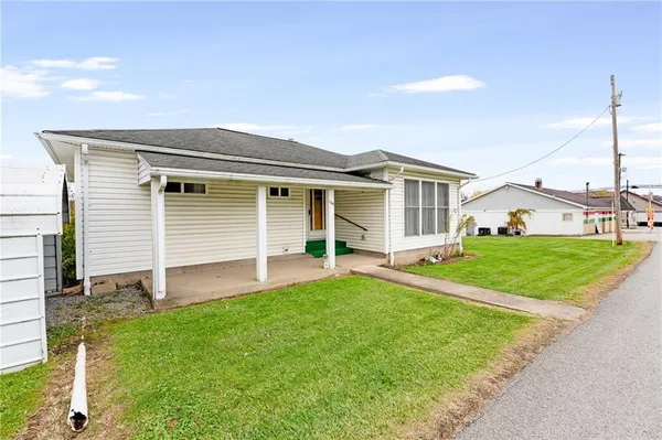 front view of a house with a yard