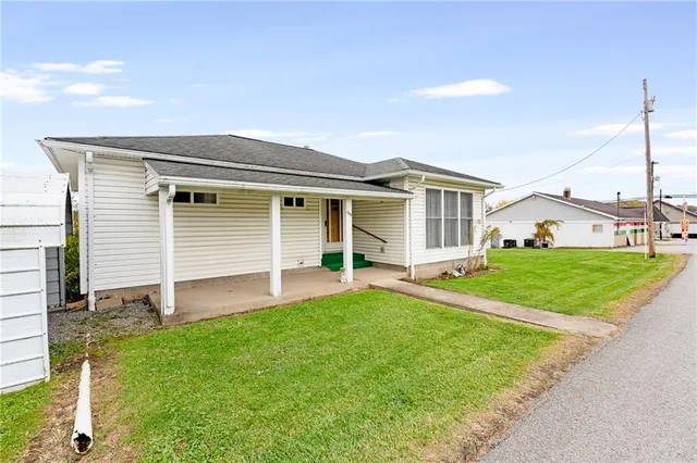 front view of a house with a yard