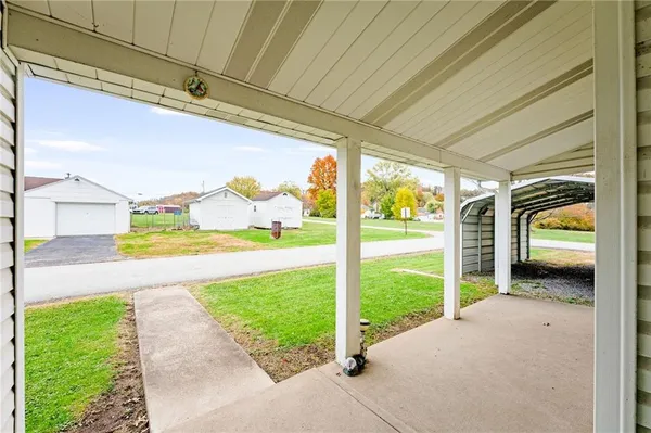 a view of a porch and garden
