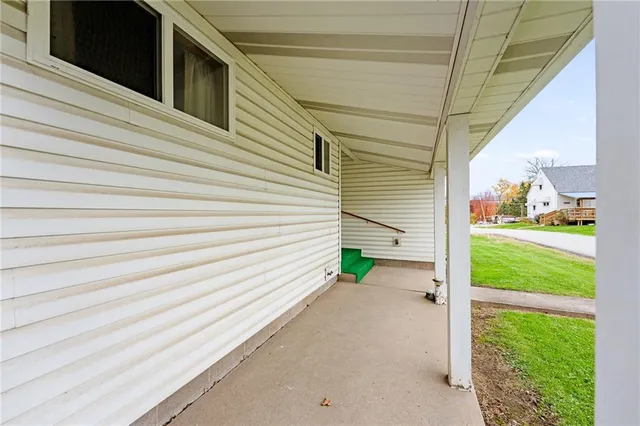 a yellow house with a outdoor space