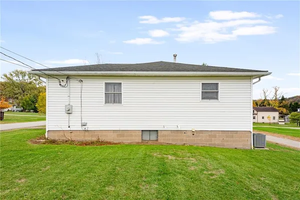 a view of a backyard with plants and a backyard
