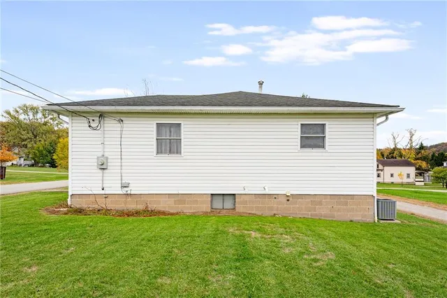 a view of a backyard with plants and a backyard