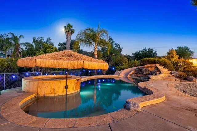 a view of swimming pool with outdoor seating