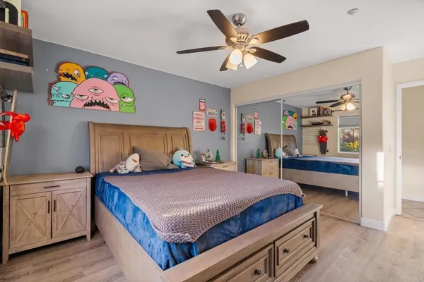 a bedroom with a bed and furniture