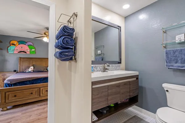 a bathroom with a sink a vanity and a mirror