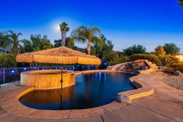 a view of swimming pool with outdoor seating