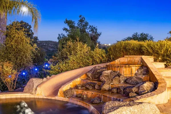 a view of swimming pool with a yard