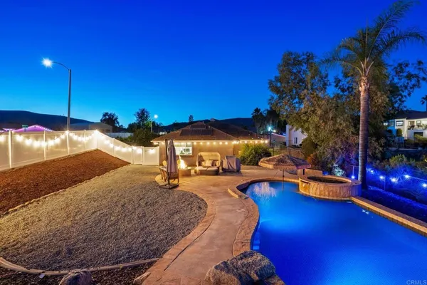 a view of a swimming pool with an outdoor space and seating area