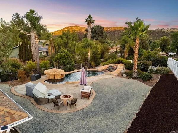 a view of a chairs and table in patio