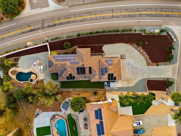 an aerial view of a house with swimming pool