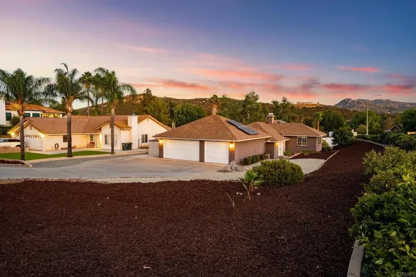 a view of houses with outdoor space and street view