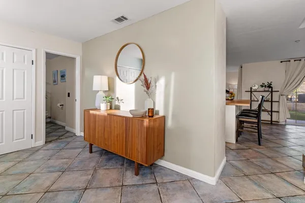 a view of a hallway with seating area