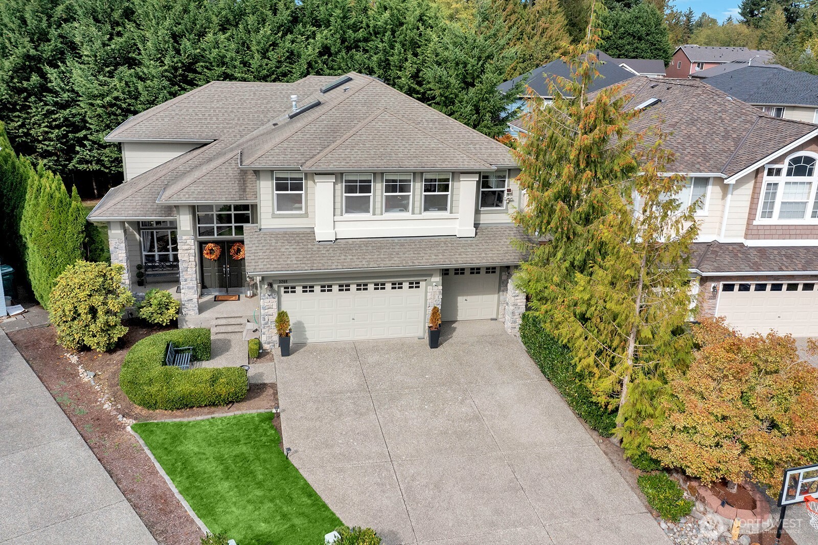 3208 175th Street Southeast Bothell, WA 98012 - Photo 1 of 34 a house with trees in front of it