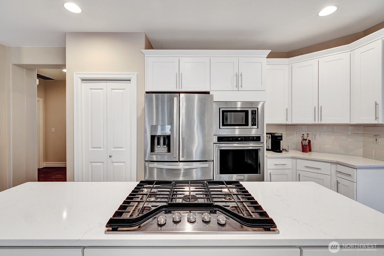 3208 175th Street Southeast Bothell, WA 98012 - Photo 12 of 34 a kitchen with white cabinets and appliances