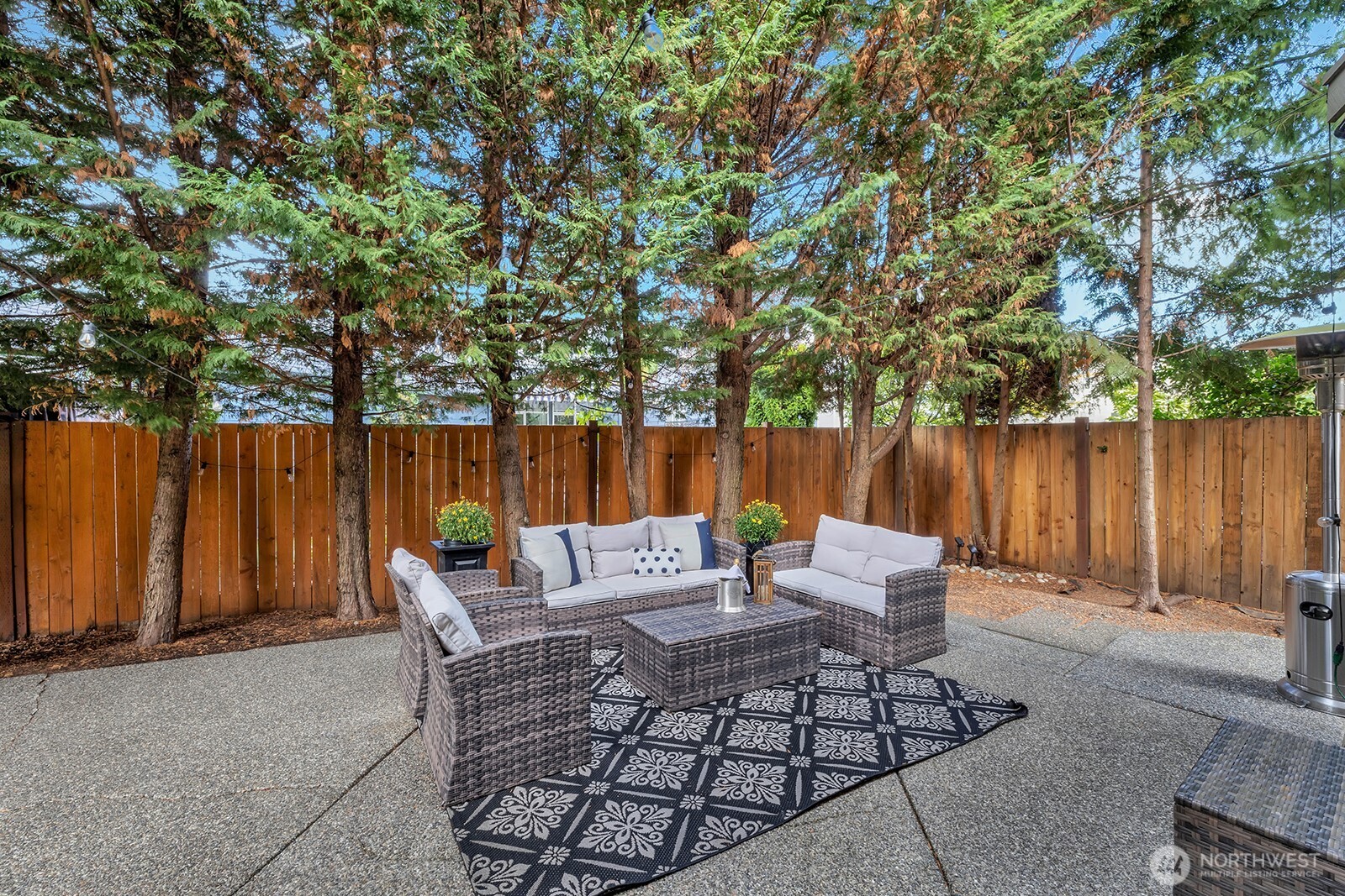 3208 175th Street Southeast Bothell, WA 98012 - Photo 15 of 34 an outdoor sitting area with furniture and wooden fence